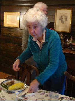 Aunt Trudi in the dining room, Cal behind her