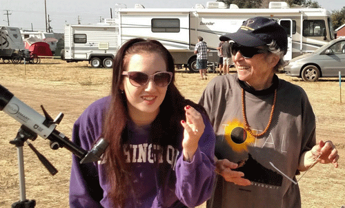  Our camping neighbor and Grace with telescope