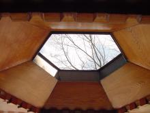 These elegant holes in the balcomy roof are necessary to keep the heavy winter snows from destroying it
