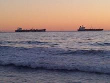 Ships parked by Dockweiler State Beach, near LAX, CA